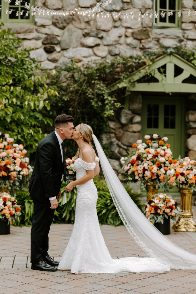 Bride and Groom kiss after their sweet first look at The Willowdale Estate in Topsfield, Massachusetts.
