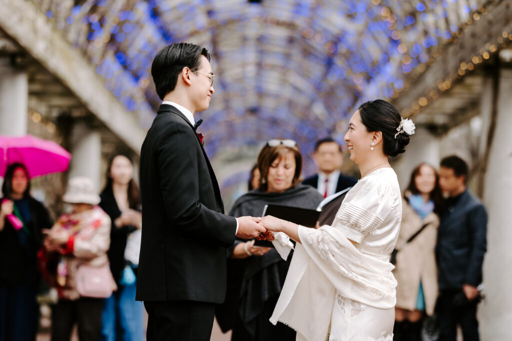 Bride and groom exchange vows at Christopher Columbus Park in Boston