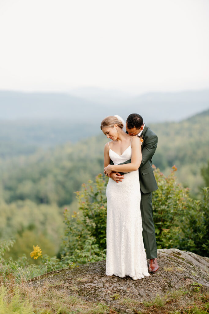 Bride and groom portrait at Ogontz Resort in New Hampshire overlooking the white mountains