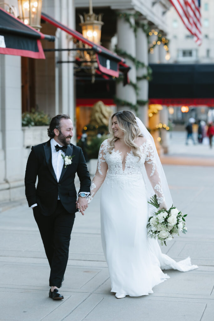 Bride and groom portrait outside Fairmont Copley Plaza on their wedding day in Boston
