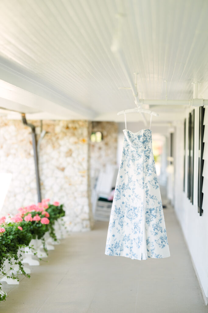 Wedding rehearsal dinner dress hanging at Bald Peak Colony Club in New Hampshire