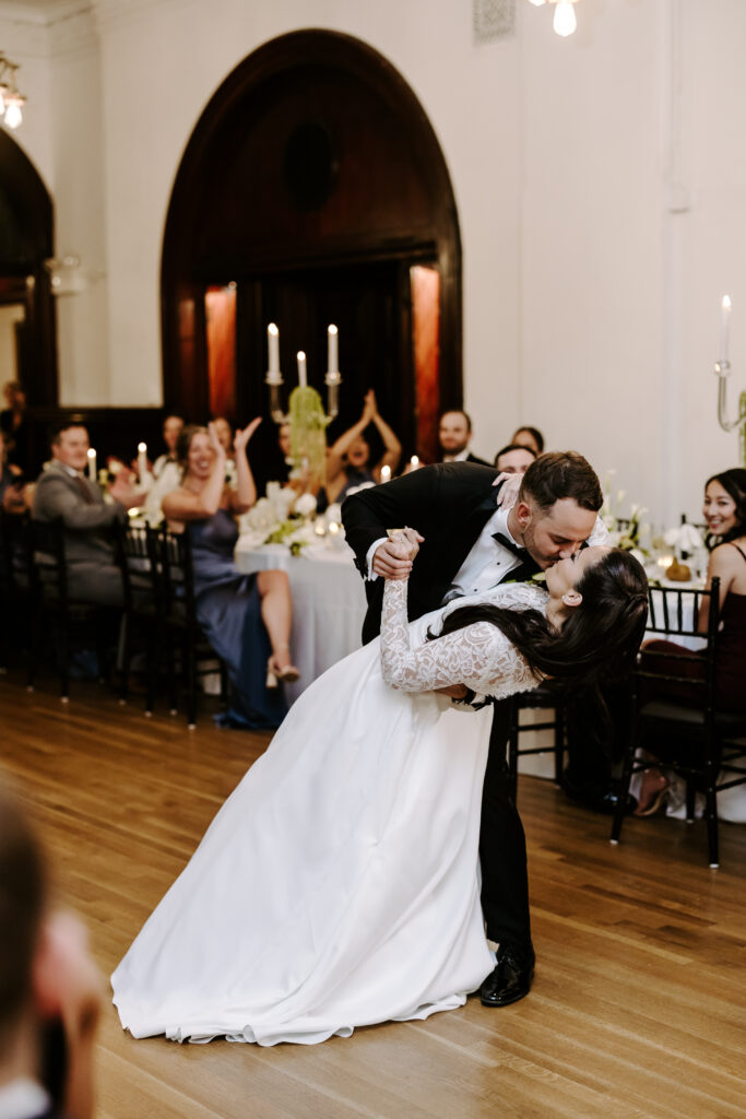 Groom dips his bride during first dance at The Tower in Boston, Massachusetts