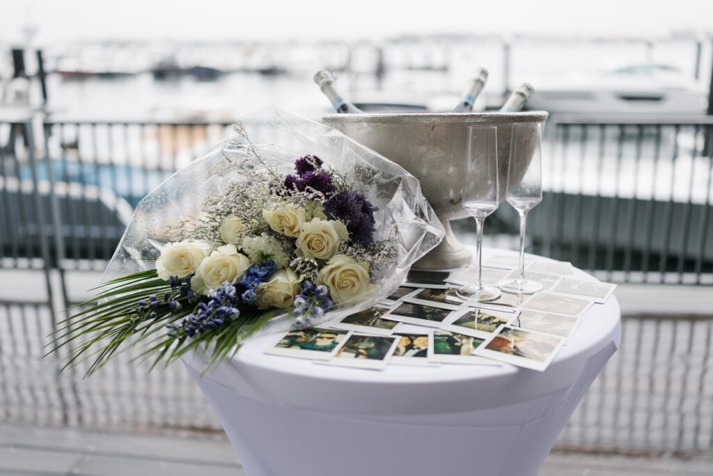 flowers and polaroids set up for surprise proposal