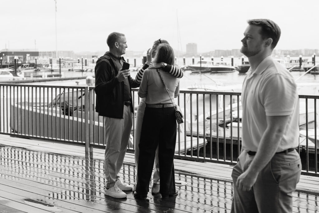 friends hugging after surprise proposal