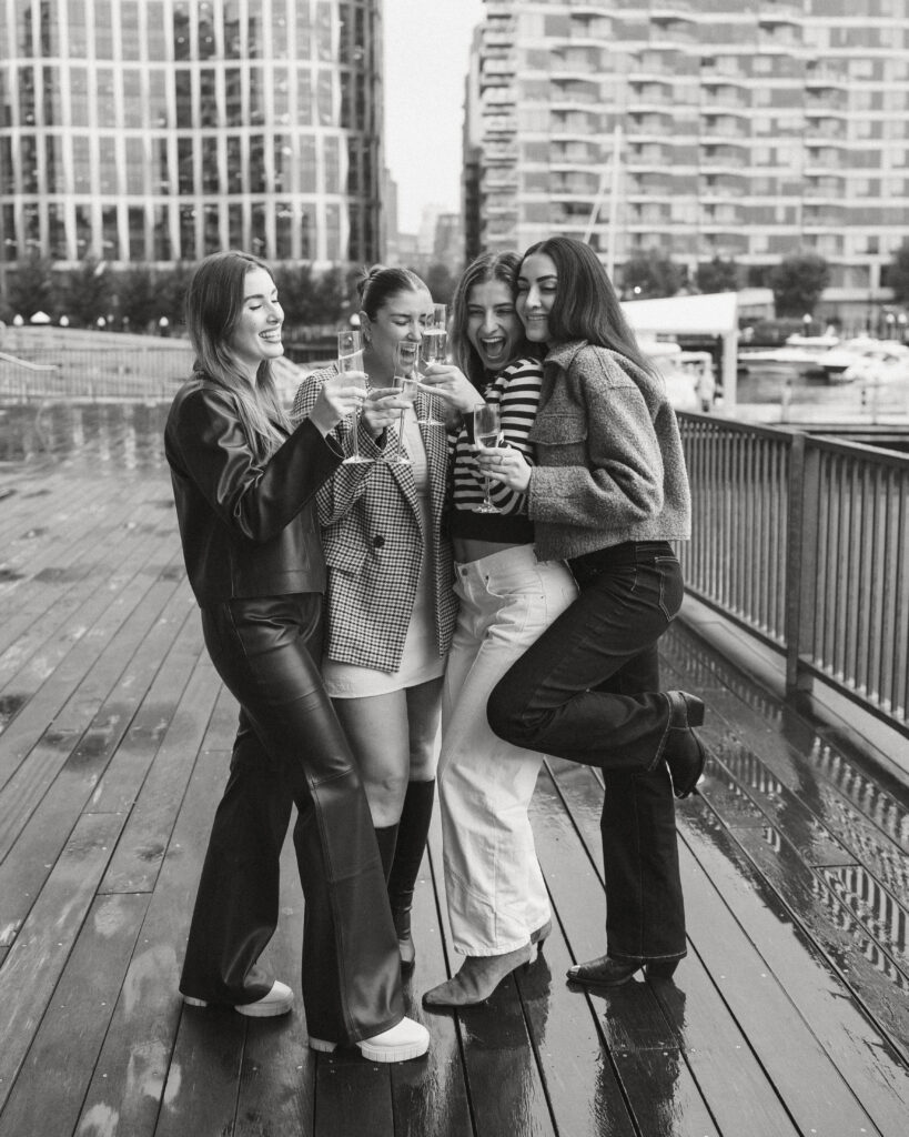 Friends after proposal engagement in Boston Seaport