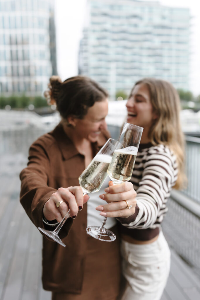 Friends after proposal engagement in Boston Seaport