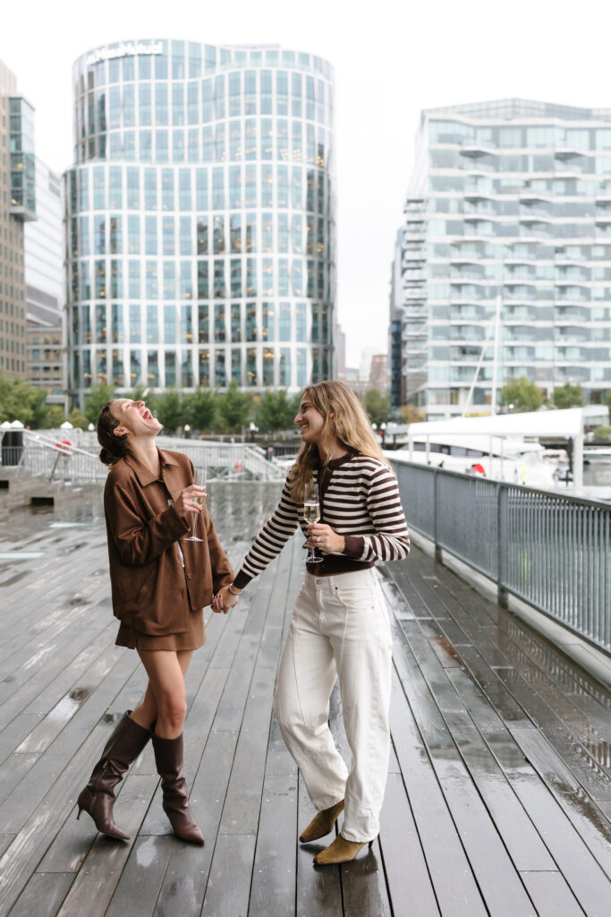 Friends after proposal engagement in Boston Seaport