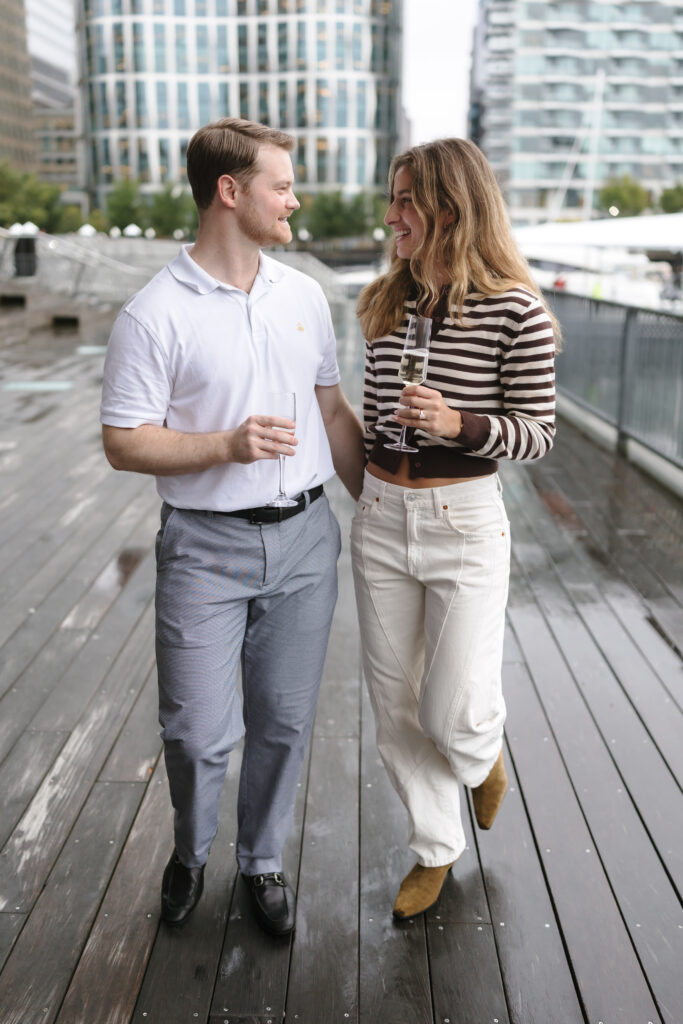 Engagement photos after surprise proposal in Boston Seaport. Boston wedding photographer