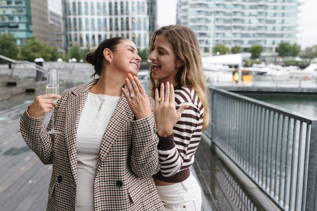Friends after proposal engagement in Boston Seaport