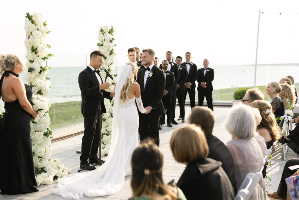 Wedding ceremony on rooftop terrace at wychmere beach club