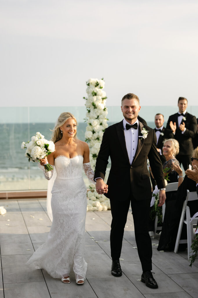 Wedding ceremony on rooftop terrace at wychmere beach club
