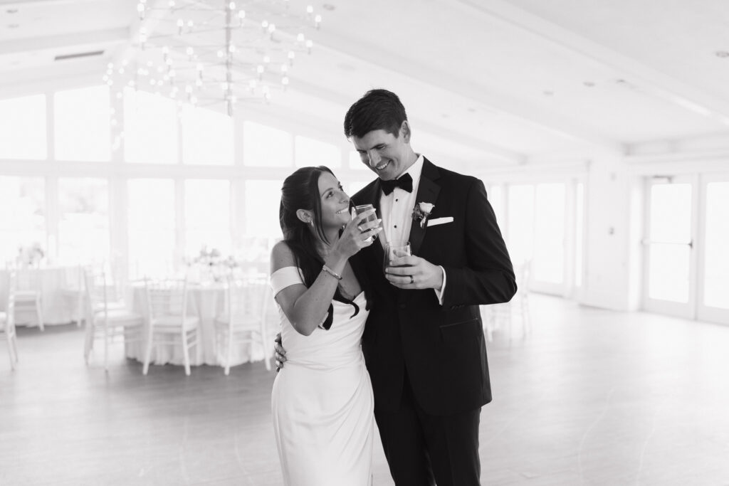 Bride and groom in the Ocean room reception space at Wychmere Beach Club wedding venue on Cape Cod