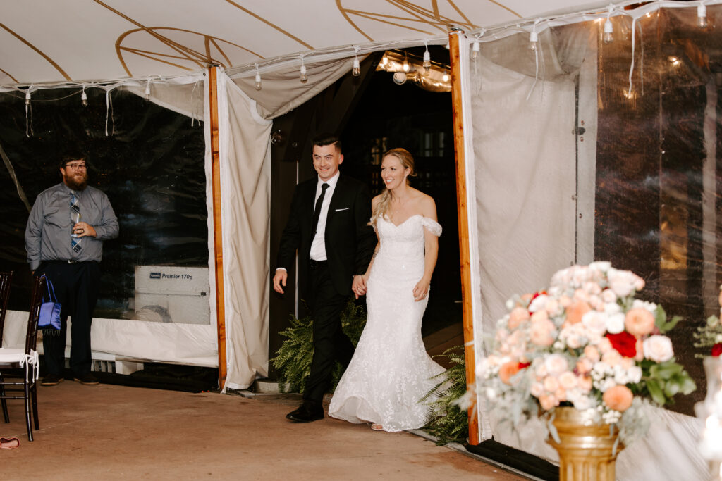 Bride and groom are announced as husband and wife and enter their tented reception at The Willowdale Estate in Topsfield, Massachusetts.