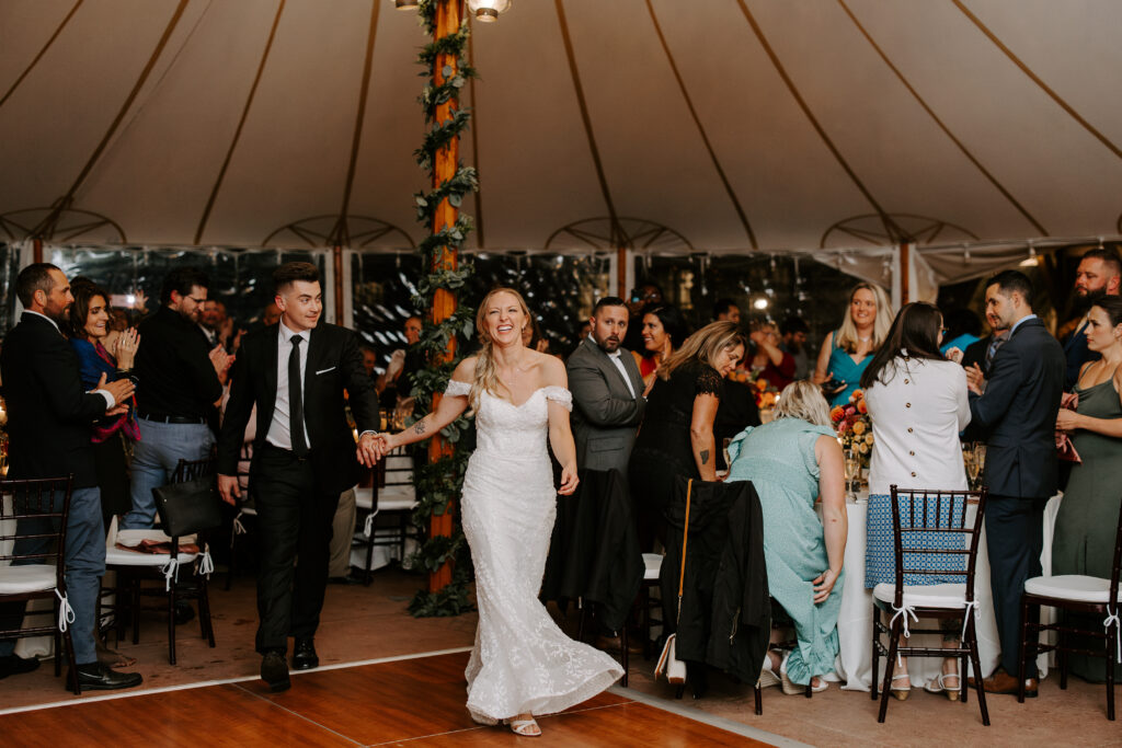 Bride and groom are announced as husband and wife and enter their tented reception and preform first dance at The Willowdale Estate in Topsfield, Massachusetts.