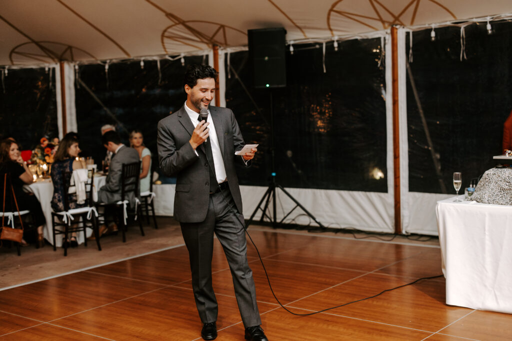 Best man gives speech at his best friend's wedding reception at The Willowdale Estate.