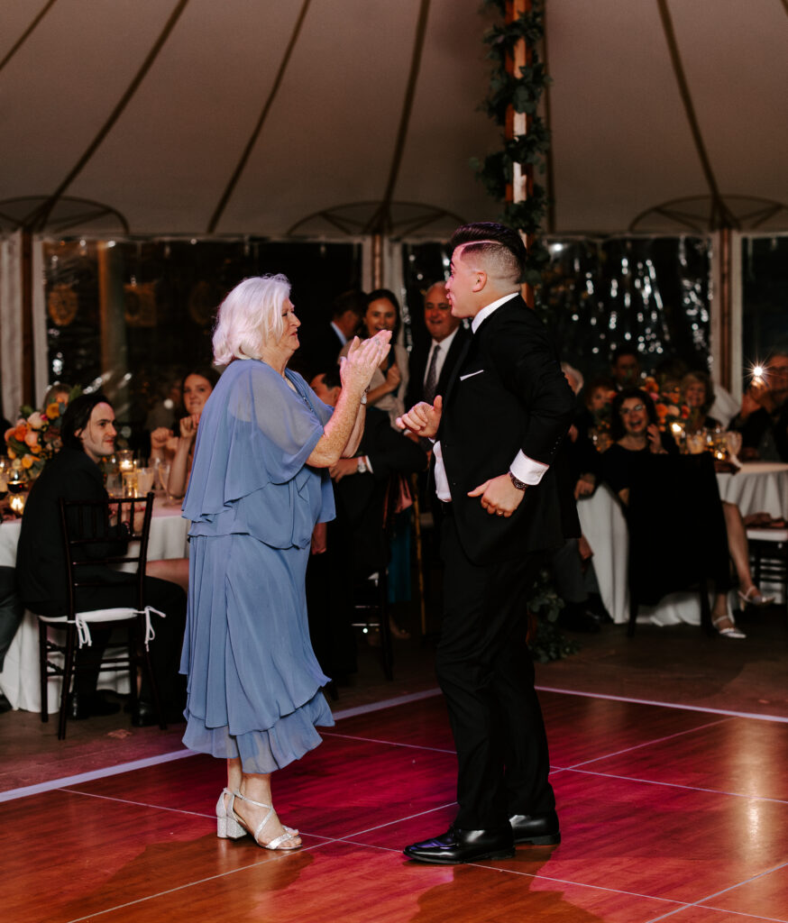 Groom and his mother share a mother son dance during wedding reception at The Willowdale Estate in Topsfield, Massachusetts.