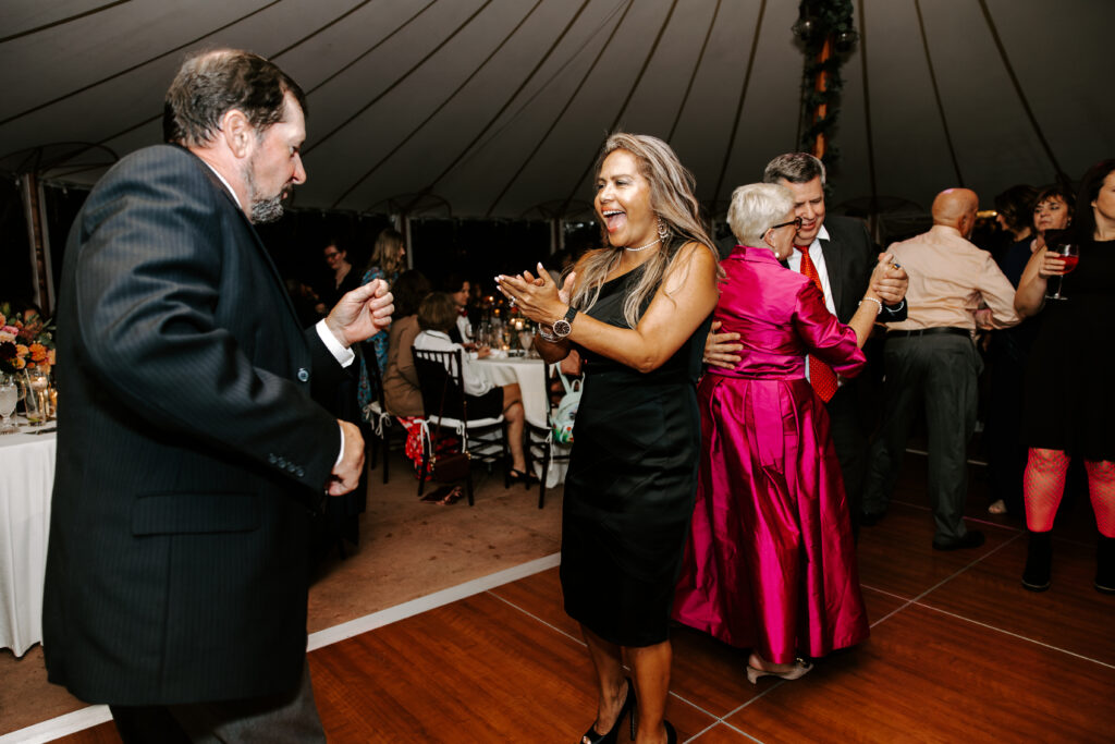 Wedding guests dance during wedding reception at The Willowdale Estate.