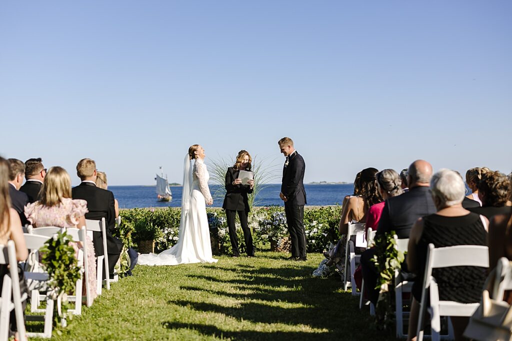 Bride and groom laugh during unplugged wedding ceremony at Misselwood Events in Beverly, MA.