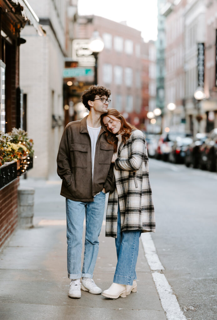 couple gets cozy with each other on north end boston street