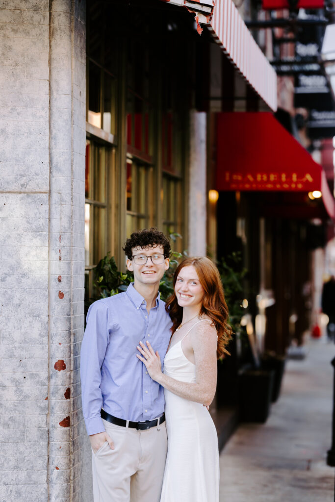 Couple smiles at the camera in boston engagement photo