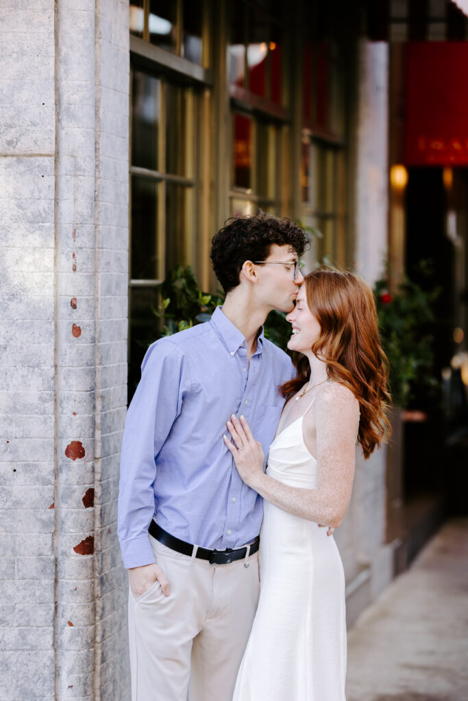 Couples posing engagement session idea in the city