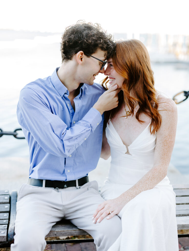 Bride and groom go nose to nose and nuzzle during boston engagement photos