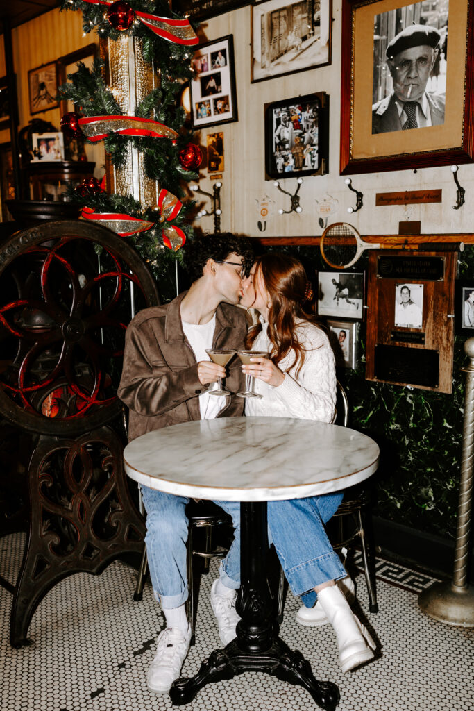 bride and groom kiss over espresso martinis in boston