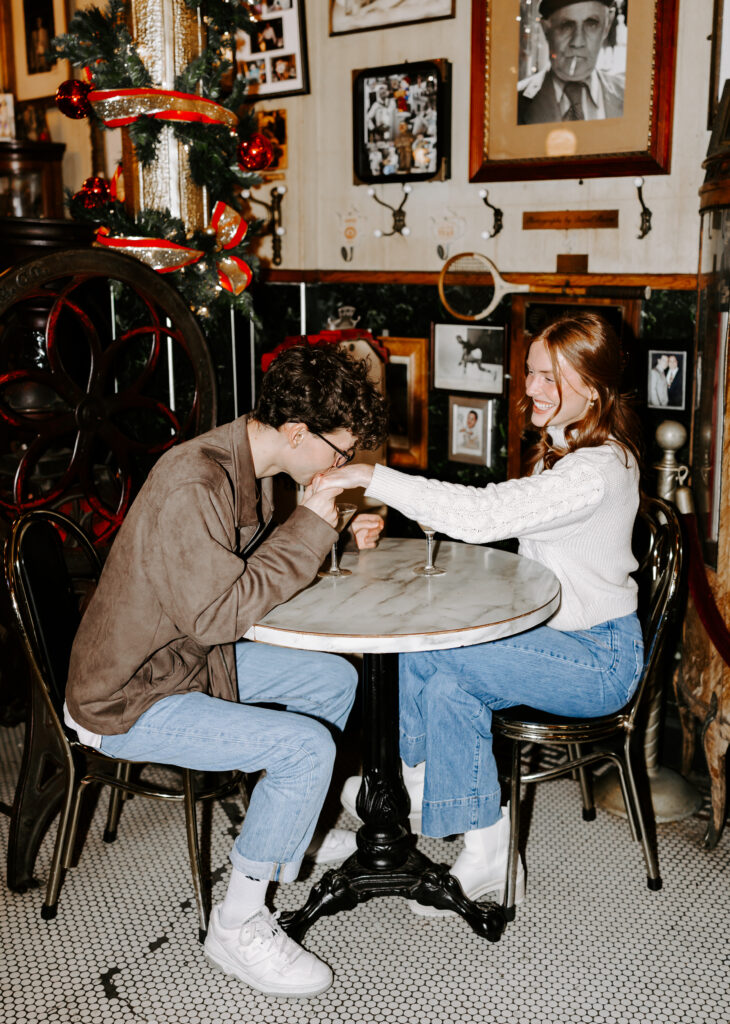 Boston engagement photos in a cozy cafe coffee shop with espresso martinis