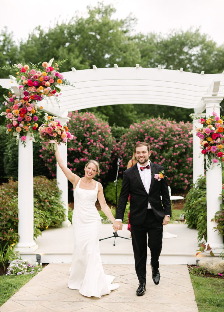 Couple walks down the aisle hand in hand after tying the knot in Massachusetts