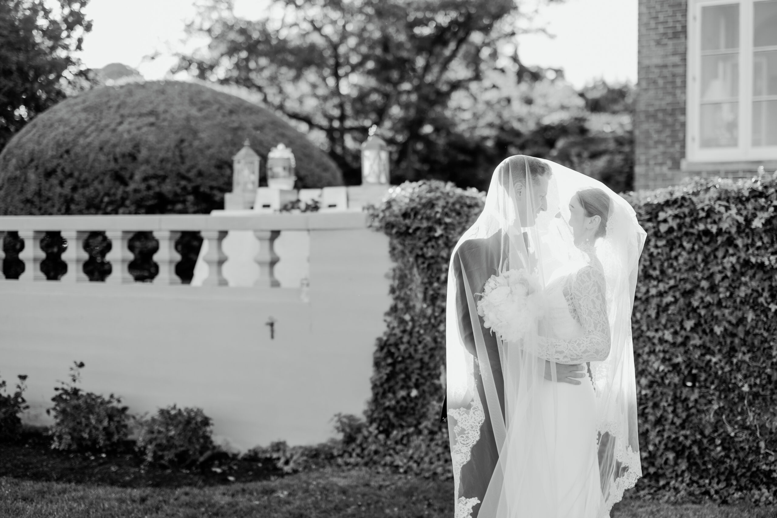 Boston wedding photographer at Misselwood Events, photo of bride and groom underneath the veil at the venue